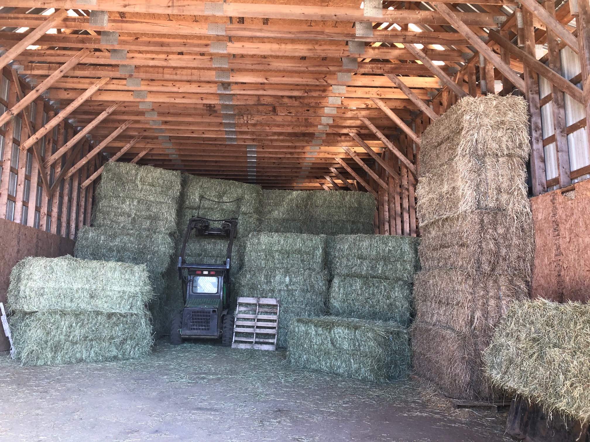 stacked large square hay bales for sale